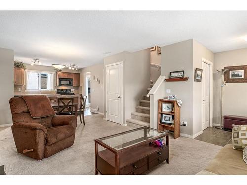 214 Panamount Way Nw, Calgary, AB - Indoor Photo Showing Living Room