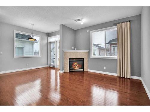 50 Tucker Circle, Okotoks, AB - Indoor Photo Showing Living Room With Fireplace