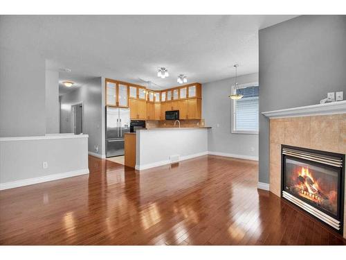 50 Tucker Circle, Okotoks, AB - Indoor Photo Showing Living Room With Fireplace