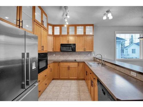 50 Tucker Circle, Okotoks, AB - Indoor Photo Showing Kitchen With Double Sink