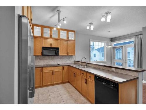 50 Tucker Circle, Okotoks, AB - Indoor Photo Showing Kitchen With Double Sink