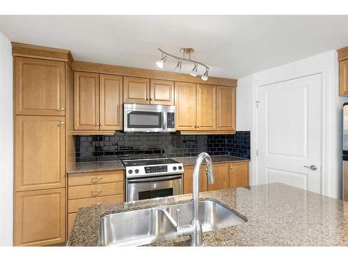 1501-910 5 Avenue Sw, Calgary, AB - Indoor Photo Showing Kitchen With Stainless Steel Kitchen With Double Sink