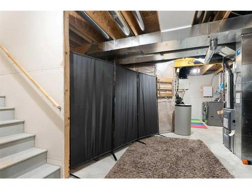 302 River Heights Crescent, Cochrane, AB - Indoor Photo Showing Basement