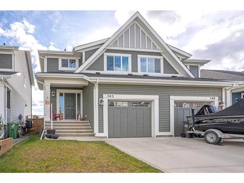 302 River Heights Crescent, Cochrane, AB - Outdoor With Facade