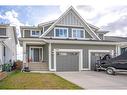 302 River Heights Crescent, Cochrane, AB  - Outdoor With Facade 