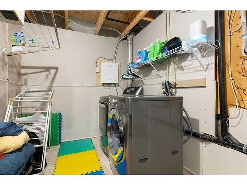 302 River Heights Crescent, Cochrane, AB - Indoor Photo Showing Laundry Room