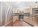 1104-10 Prestwick Bay Se, Calgary, AB  - Indoor Photo Showing Kitchen With Double Sink With Upgraded Kitchen 