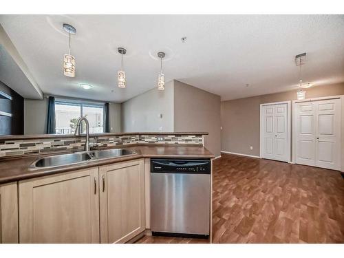 1104-10 Prestwick Bay Se, Calgary, AB - Indoor Photo Showing Kitchen With Double Sink