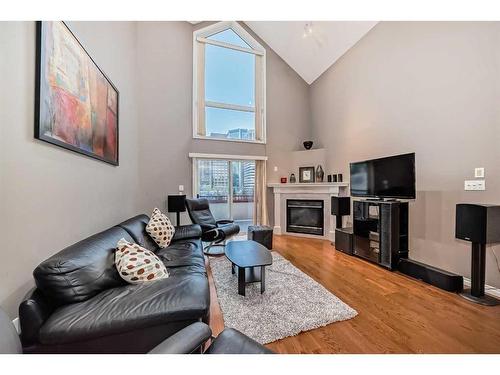 514-777 3 Avenue Sw, Calgary, AB - Indoor Photo Showing Living Room With Fireplace