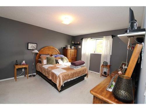 13 Big Springs Drive Se, Airdrie, AB - Indoor Photo Showing Bedroom