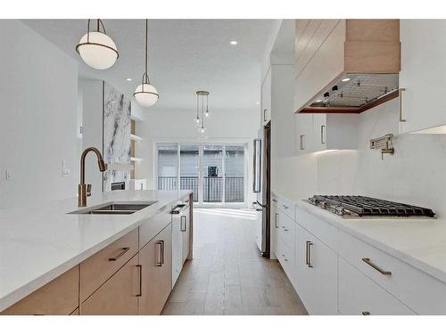 1143 Richland Road Ne, Calgary, AB - Indoor Photo Showing Kitchen With Double Sink With Upgraded Kitchen