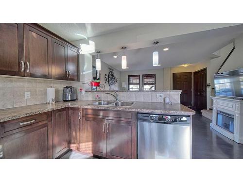 15 Elgin Meadows Gardens Se, Calgary, AB - Indoor Photo Showing Kitchen With Double Sink