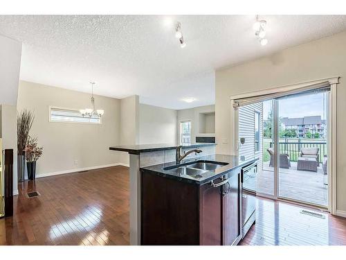 32 Silverado Saddle Court Sw, Calgary, AB - Indoor Photo Showing Kitchen With Double Sink