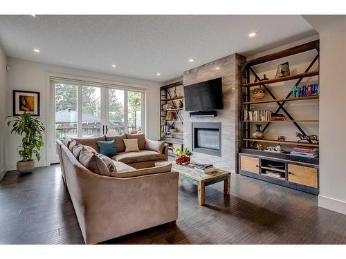 3607 Kildare Crescent Sw, Calgary, AB - Indoor Photo Showing Living Room With Fireplace