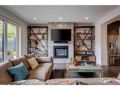 3607 Kildare Crescent Sw, Calgary, AB - Indoor Photo Showing Living Room With Fireplace