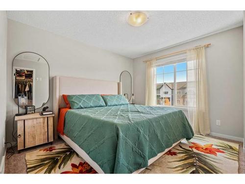 25 Creekside Boulevard Sw, Calgary, AB - Indoor Photo Showing Bedroom