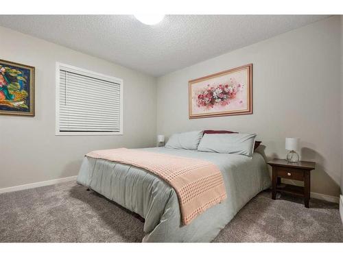 25 Creekside Boulevard Sw, Calgary, AB - Indoor Photo Showing Bedroom