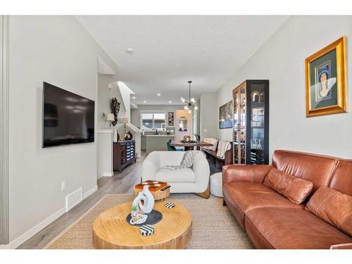 25 Creekside Boulevard Sw, Calgary, AB - Indoor Photo Showing Living Room