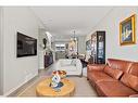 25 Creekside Boulevard Sw, Calgary, AB  - Indoor Photo Showing Living Room 