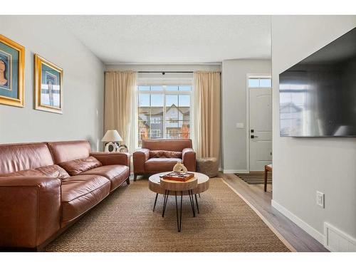 25 Creekside Boulevard Sw, Calgary, AB - Indoor Photo Showing Living Room