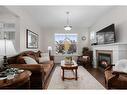 98 Williamstown Landing Nw, Airdrie, AB  - Indoor Photo Showing Living Room With Fireplace 