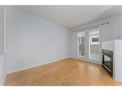 206-1026 12 Avenue Sw, Calgary, AB - Indoor Photo Showing Other Room With Fireplace