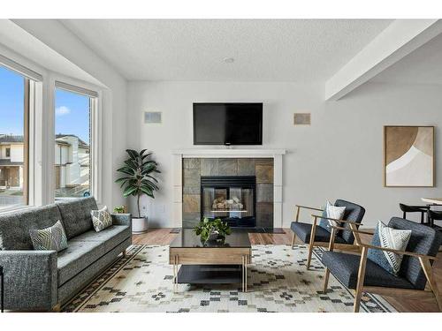 105 Patina Park Sw, Calgary, AB - Indoor Photo Showing Living Room With Fireplace