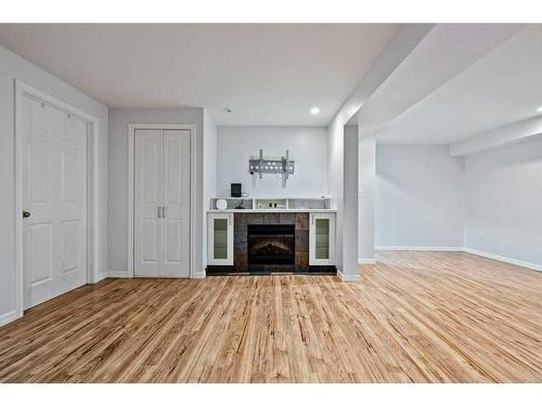 105 Patina Park Sw, Calgary, AB - Indoor With Fireplace