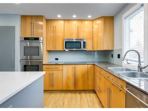 308 Silvergrove Bay Nw, Calgary, AB - Indoor Photo Showing Kitchen With Double Sink