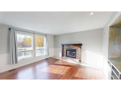 311 Hawkland Place Nw, Calgary, AB - Indoor Photo Showing Living Room With Fireplace