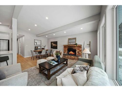 343 Weddenburn Road Se, Calgary, AB - Indoor Photo Showing Living Room With Fireplace