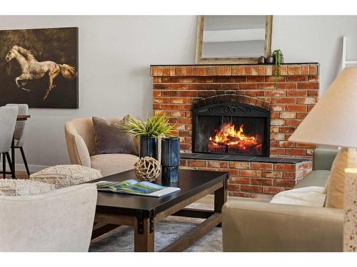 343 Weddenburn Road Se, Calgary, AB - Indoor Photo Showing Living Room With Fireplace