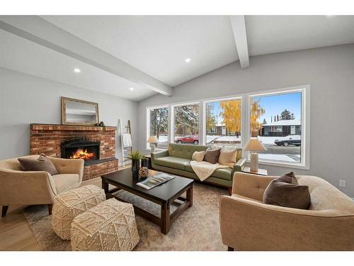 343 Weddenburn Road Se, Calgary, AB - Indoor Photo Showing Living Room With Fireplace