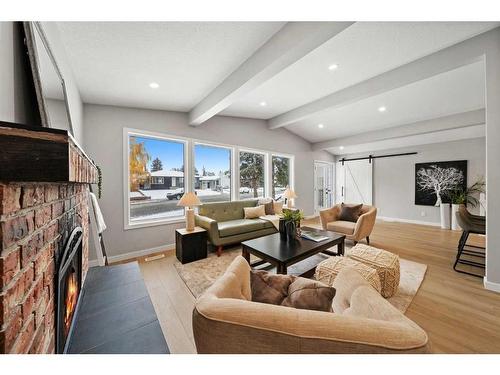 343 Weddenburn Road Se, Calgary, AB - Indoor Photo Showing Living Room With Fireplace