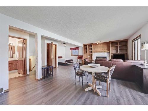 24 Del Ray Place Ne, Calgary, AB - Indoor Photo Showing Dining Room With Fireplace