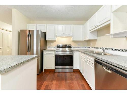 338 Mt Douglas Manor Se, Calgary, AB - Indoor Photo Showing Kitchen With Stainless Steel Kitchen With Double Sink