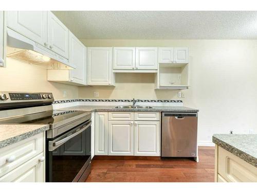 338 Mt Douglas Manor Se, Calgary, AB - Indoor Photo Showing Kitchen With Stainless Steel Kitchen With Double Sink