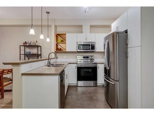 215-3600 15A Street Sw, Calgary, AB - Indoor Photo Showing Kitchen With Double Sink