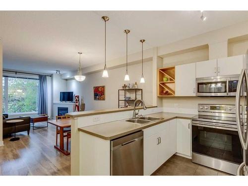 215-3600 15A Street Sw, Calgary, AB - Indoor Photo Showing Kitchen With Double Sink