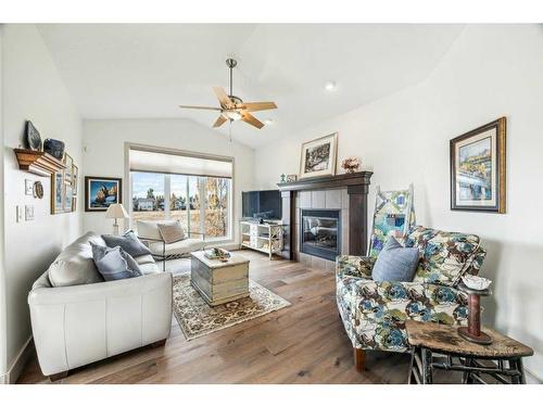 135 Tuscany Ravine Heights Nw, Calgary, AB - Indoor Photo Showing Living Room With Fireplace