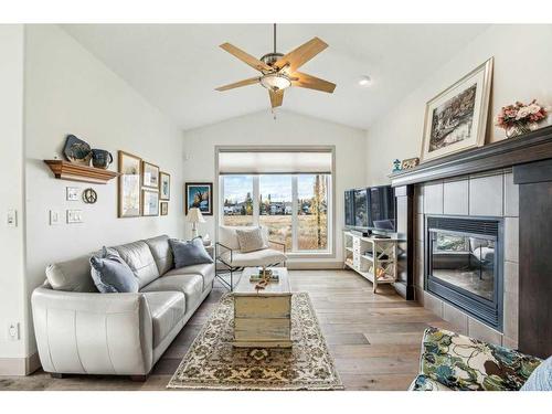 135 Tuscany Ravine Heights Nw, Calgary, AB - Indoor Photo Showing Living Room With Fireplace