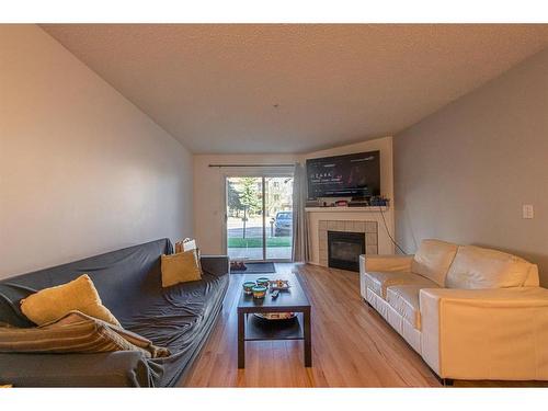 2112-20 Harvest Rose Park Ne, Calgary, AB - Indoor Photo Showing Living Room With Fireplace