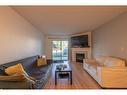 2112-20 Harvest Rose Park Ne, Calgary, AB  - Indoor Photo Showing Living Room With Fireplace 