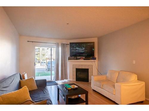 2112-20 Harvest Rose Park Ne, Calgary, AB - Indoor Photo Showing Living Room With Fireplace