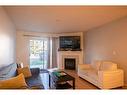 2112-20 Harvest Rose Park Ne, Calgary, AB  - Indoor Photo Showing Living Room With Fireplace 