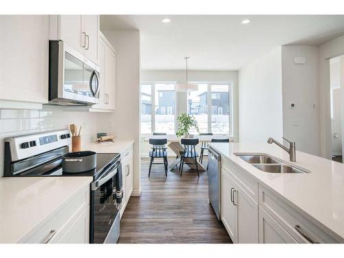 40 Ellen Lane, Crossfield, AB - Indoor Photo Showing Kitchen With Double Sink With Upgraded Kitchen