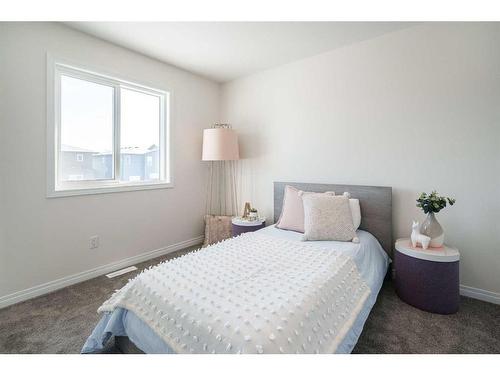 40 Ellen Lane, Crossfield, AB - Indoor Photo Showing Bedroom