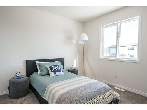 40 Ellen Lane, Crossfield, AB - Indoor Photo Showing Bedroom