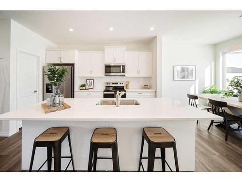 40 Ellen Lane, Crossfield, AB - Indoor Photo Showing Kitchen With Double Sink With Upgraded Kitchen