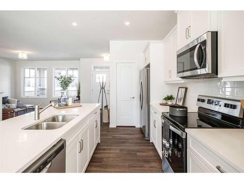 40 Ellen Lane, Crossfield, AB - Indoor Photo Showing Kitchen With Double Sink With Upgraded Kitchen